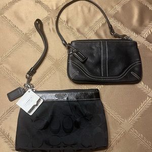 (2) Coach black wristlets